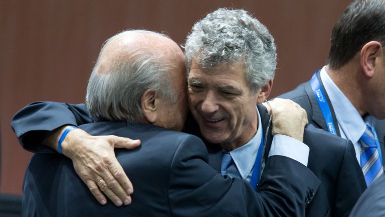 Angel Maria Villar Llona embraces FIFA president Sepp Blatter (left)