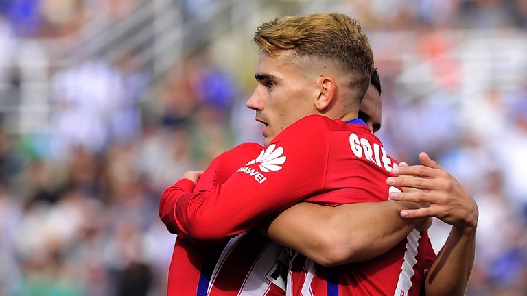 Antoine Griezmann is congratulated by Koke 