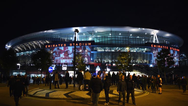 Fans walk outside the stadium prior to the UEFA Champions League Group F match between Arsenal FC and FC Bayern Munchen at Emirates Stadium