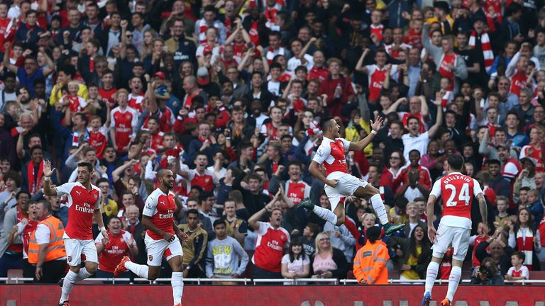 Arsenal's Alexis Sanchez (second right) celebrates scoring Arsenal's third - a thunderous strike into the top-right corner