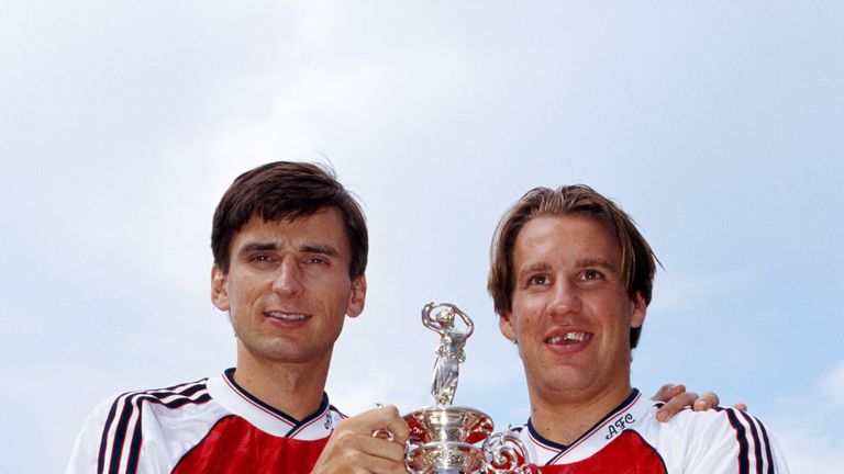 Arsenal players Alan Smith and Paul Merson pose with the First Division title in August 1991