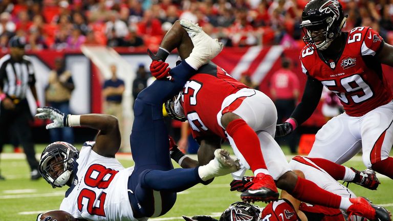 Allen Bradford #53 of the Atlanta Falcons prevents Alfred Blue #28 of the Houston Texans from scoring a touchdown in the second h