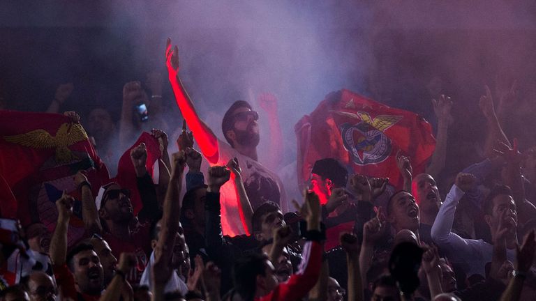 Benfica fans set off flares after opening goal against Atletico Madrid at the Vicente Calderon Stadium