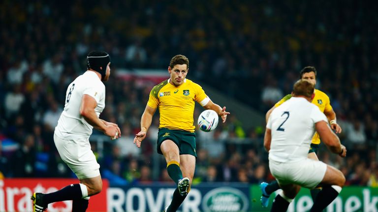 Bernard Foley of Australia puts in a kick over the England defence