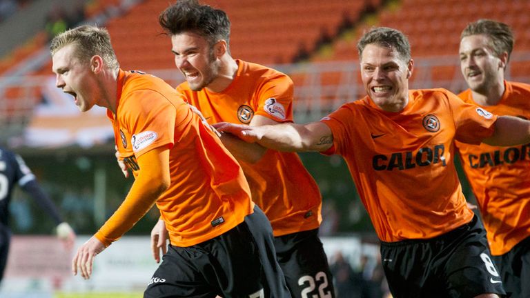 Dundee United players celebrate with Billy McKay (left) after his penalty