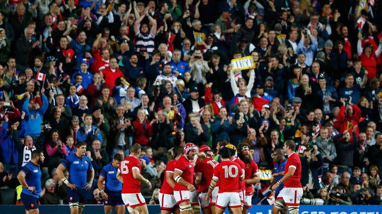 Canda players celebrate as DTH van der Merwe scores their first try