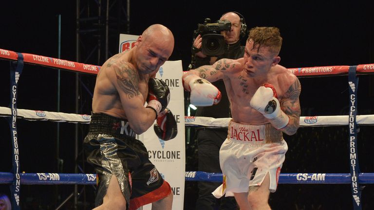 BELFAST, NORTHERN IRELAND - SEPTEMBER 6: Carl Frampton of Northern Ireland lands a punch during the IBF super-bantamweight world title bout against world c