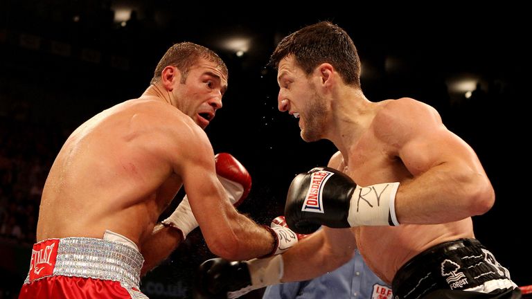 NOTTINGHAM, ENGLAND - MAY 26:  Carl Froch (R) in action with Lucian Bute during their IBF World Super Middleweight Title bout at Nottingham Capital FM Aren