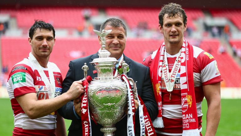 LONDON, ENGLAND - AUGUST 24:  Wigan Warriors coach Shaun Wane poses with the trophy alongside Sean O'Loughlin (R) and Matthew Smith (L) of Wigan Warriors a