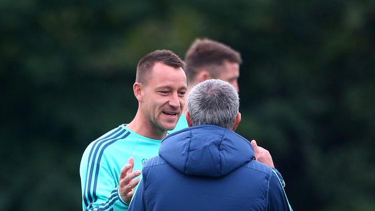 Chelsea manager Jose Mourinho greets John Terry during a Chelsea training session