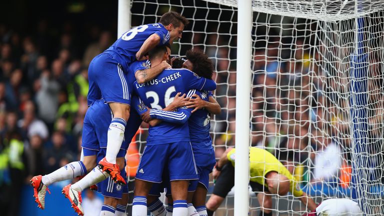 LONDON, ENGLAND - OCTOBER 17: Chelsea players celebrate their team's first goal by Diego Costa (obscured) 