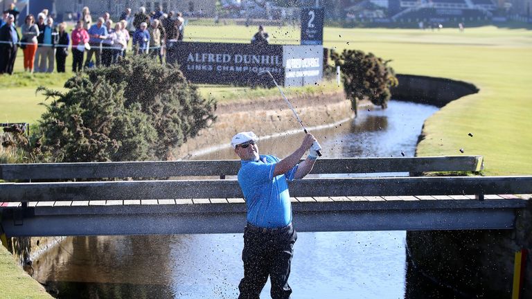 ST ANDREWS, SCOTLAND - OCTOBER 01:  Chris Doak of Scotland plays his second shot out from the burn on the first hole during the first round of the 2015 Alf