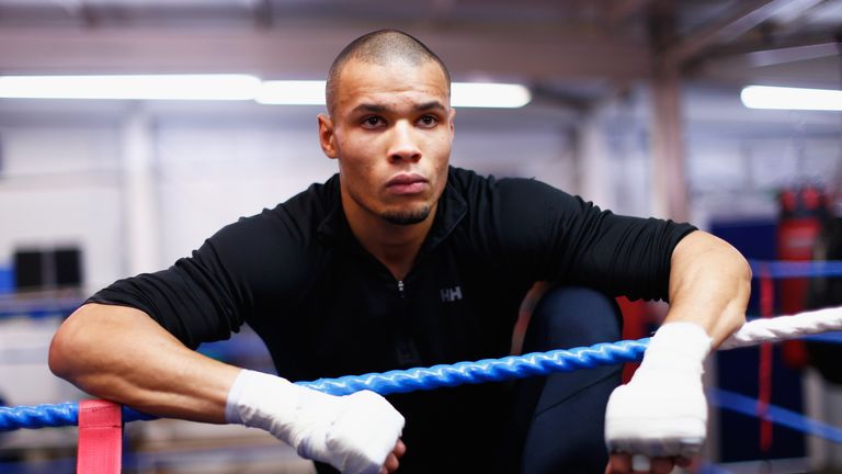 LONDON, ENGLAND - FEBRUARY 24:  Chris Eubank Jnr looks on as he stretches during a media work out at the Peacock Gym on February 24, 2015 in London, Englan