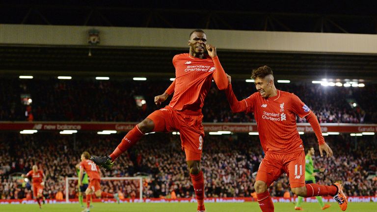 Liverpool's Belgian striker Christian Benteke celebrates with Liverpool's Brazilian midfielder Roberto Firmino 