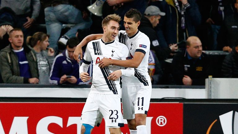 Christian Eriksen is congratulated by Erik Lamela