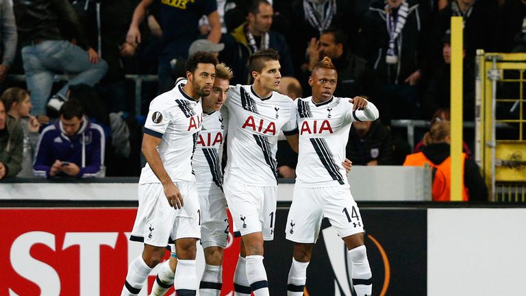 Christian Eriksen (2nd L) of Spurs is congratulated by teammates after scoring the opening goal