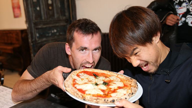 Christian Fuchs and Shinji Okazaki tuck into a pizza - their reward for keeping a clean sheet against Crystal Palace