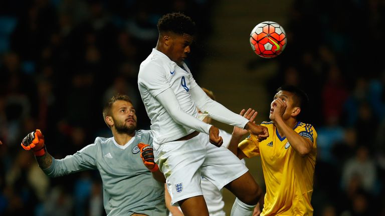 Chuba Akpom of England heads toward goal