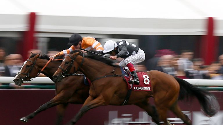 Pat Smullen riding Covert Love (orange) win The Prix De L'Opera Longines from Jazzi Top and Frankie Dettori at Longchamp