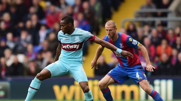 Diafra Sakho of West Ham United and Brede Hangeland of Crystal Palace compete for the ball