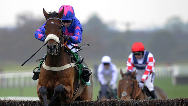 Cue Card and Paddy Brennan jump the final fence as they go on to win the bet365 Charlie Hall Chase