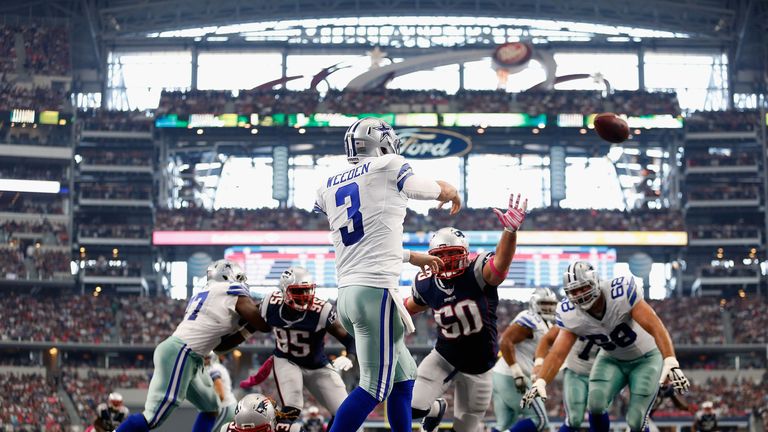 Quarterback Brandon Weeden #3 of the Dallas Cowboys passes from the end zone as defensive end Rob Ninkovich #50