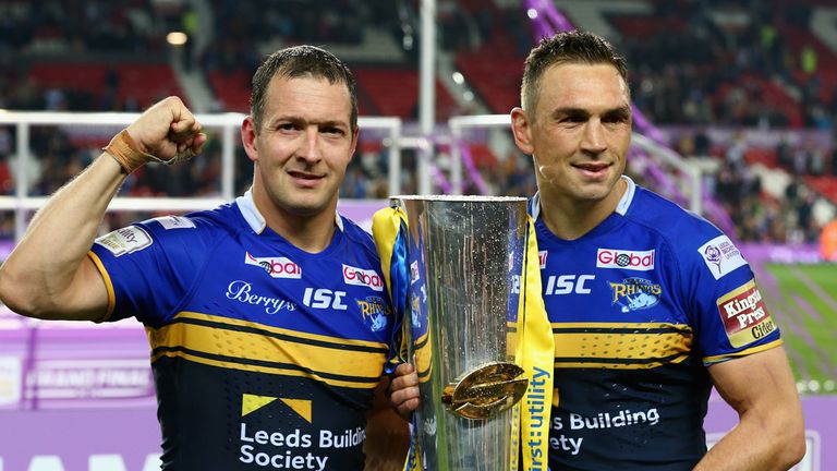 MANCHESTER, ENGLAND - OCTOBER 10:  Kevin Sinfield captain of the Leeds Rhinos (R) celebrates as he holds the trophy with his team mate and man of the match