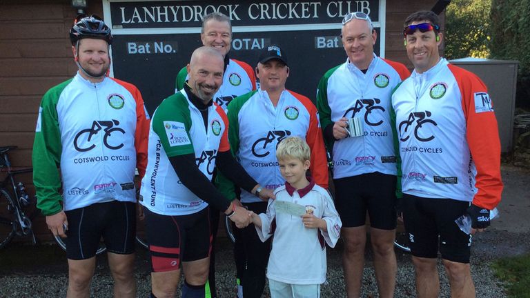 Matthew Maynard receives a donation from Lanhydrock Cricket Club