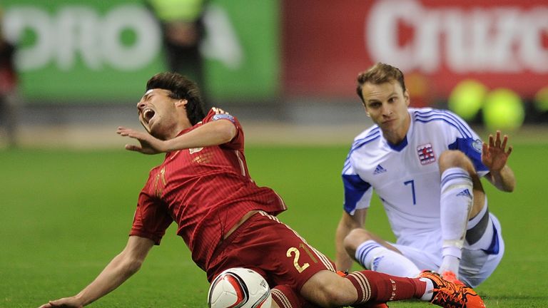  David Silva of Spain is fouled by Lars Gerson of Luxembourg 