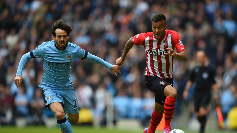 David Silva of Manchester City and Ryan Bertrand of Southampton compete for the ball during the Barclays Premier League match