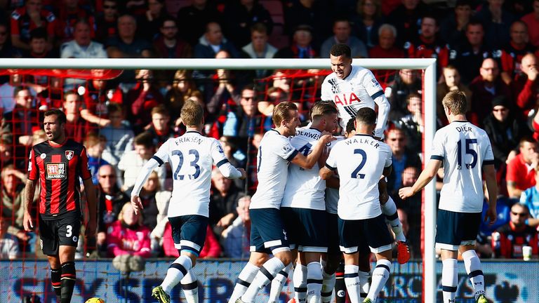 Spurs players celebrate their second goal by Mousa Dembele (obscured)