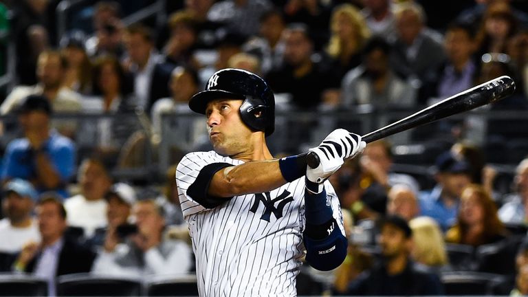 Derek Jeter #2 of the New York Yankees hits a home run in the sixth inning against the Toronto Blue Jays at Yankee Stadium on