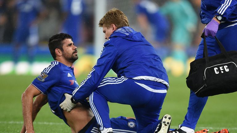 Diego Costa receives treatment to a chest injury before being substituted against Stoke