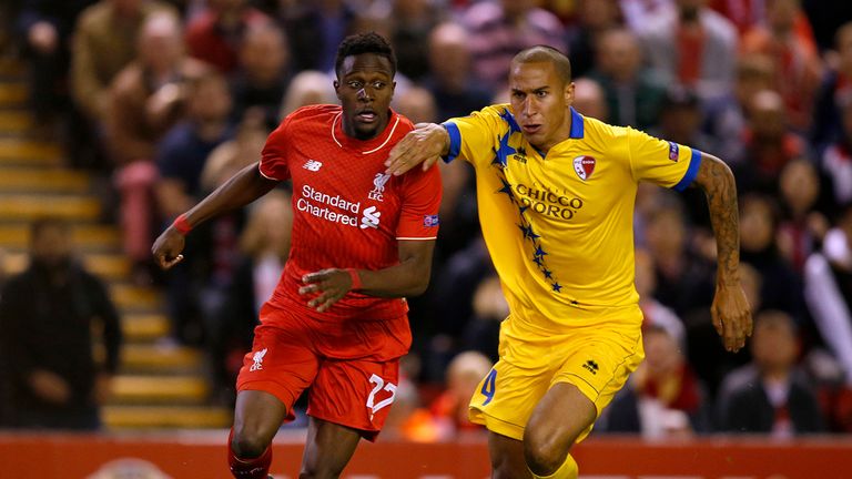 Liverpool's Divock Origi and FC Sion's Leo Lacroix battle for the ball 