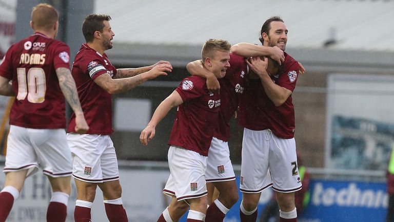 Dominic Calvert-Lewin of Northampton Town is congratulated by team mates after scoring his side's first goal