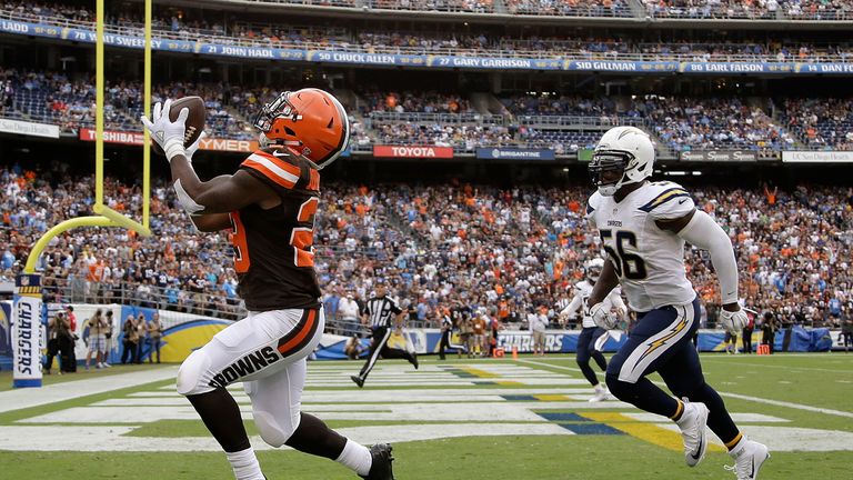 Running back Duke Johnson Jr. #29 of the Cleveland Browns catches a touchdown pass in front of Donald Butler #56 of the San Di