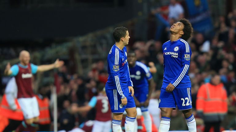 Chelsea's Willian (right) and Eden Hazard look dejected as West Ham United celebrate Andy Carroll's goal