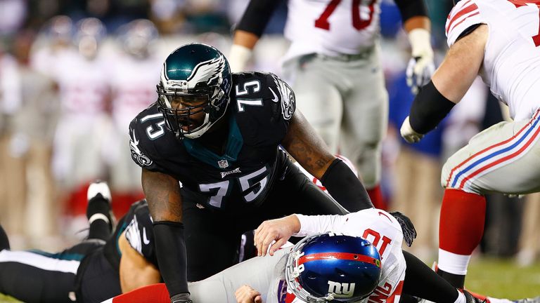 New York Giants quarterback Eli Manning is taken down by Vinny Curry of the Philadelphia Eagles