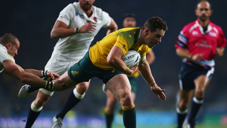 Bernard Foley breaks through to score Australia's first try.