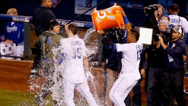 KANSAS CITY, MO - OCTOBER 27:  Salvador Perez #13 of the Kansas City Royals douses Eric Hosmer #35 of the Kansas City Royals after defeating the New York M