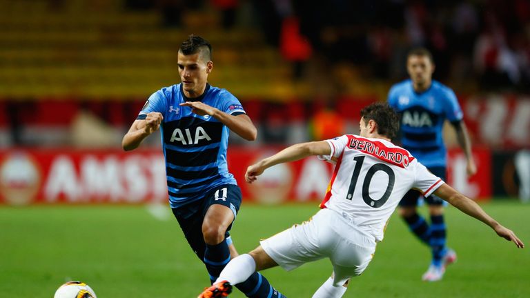 Tottenham's Erik Lamela (L) is tackled by Bernardo Silva of Monaco during the Europa League group J match 