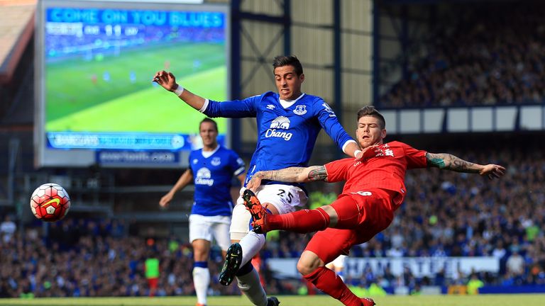 Everton's Ramiro Funes Mori (left) and Liverpool's Alberto Moreno battle for the ball 