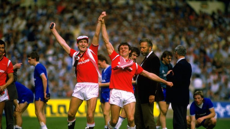 Norman Whiteside and Steve Moran of Manchester United celebrate after the FA Cup final against Everton at Wembley