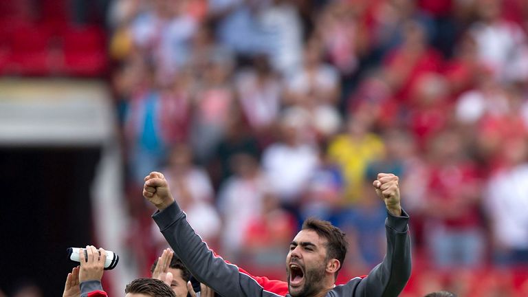 Vicente Iborra (R) of Sevilla FC celebrates their victory with his team-mate Kevin Gameiro (R) after the La Liga match against Barcelona