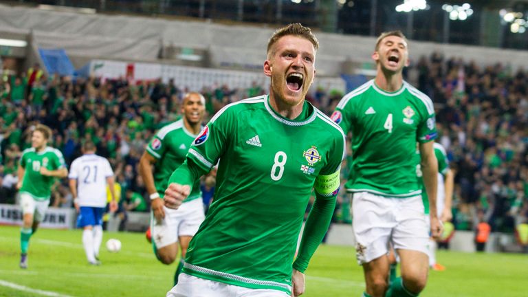Northern Ireland's Steven Davis celebrates after scoring his side's third goal 
