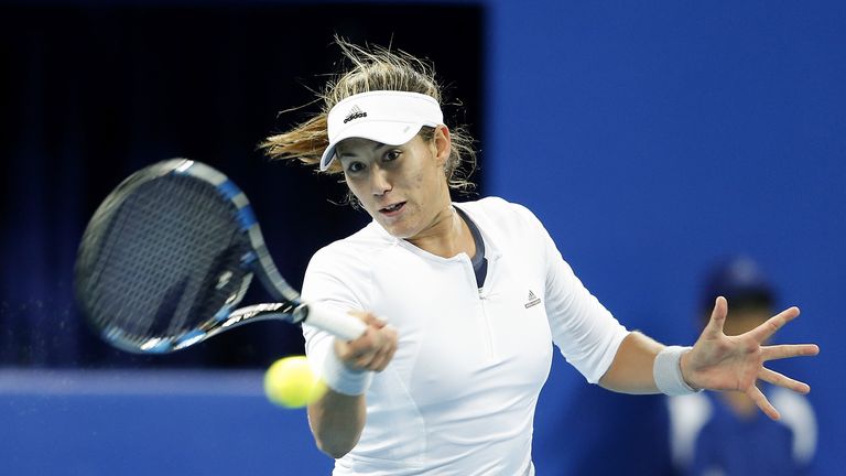 BEIJING, CHINA - OCTOBER 10:  Garbine Muguruza of Spain returns a shot against Agnieszka Radwanska of Poland during their Women's singles semi-finals match