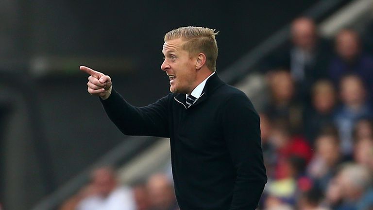 Garry Monk says it is time for the Euro 2016 qualifiers to turn their full attention to Swansea