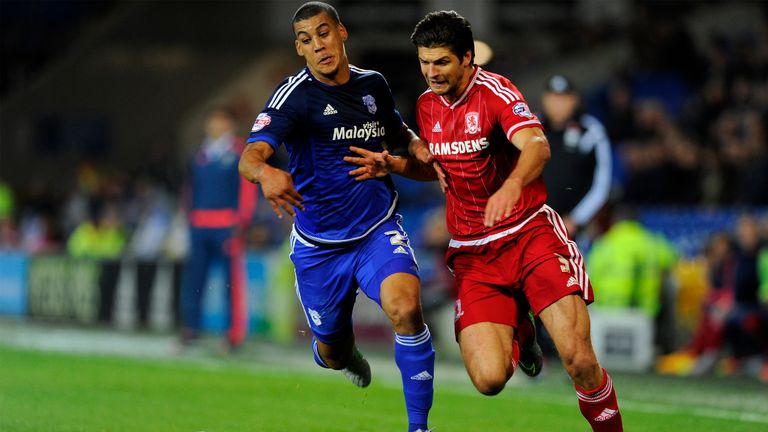 George Friend of Middlesbrough is tackled by Lee Peltier of Cardiff City 