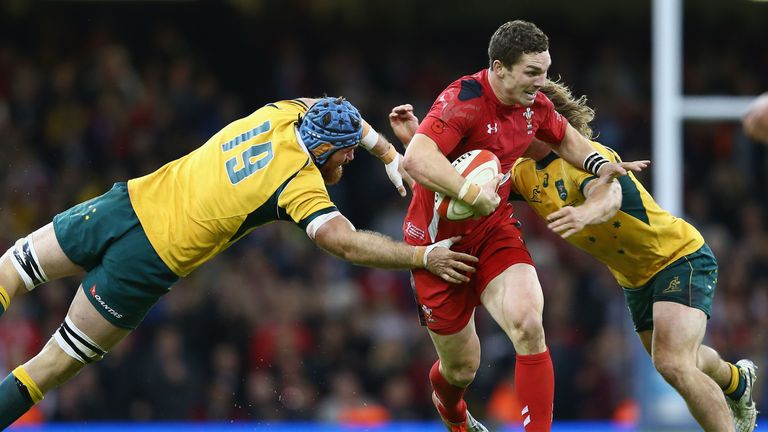 George North (C) of Wales cuts the Australian defence