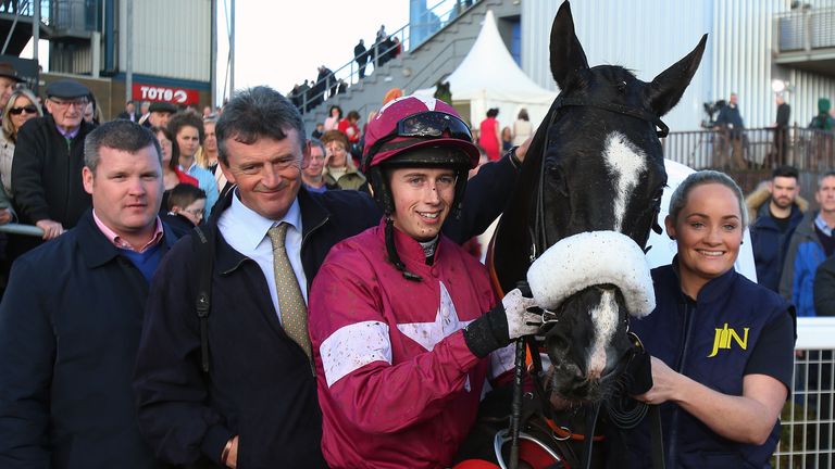 Don Cossack's trainer Gordon Elliot, owner Eddie O'Leary and jockey Bryan Cooper celebrate winning The JNwine.com Champion Chase